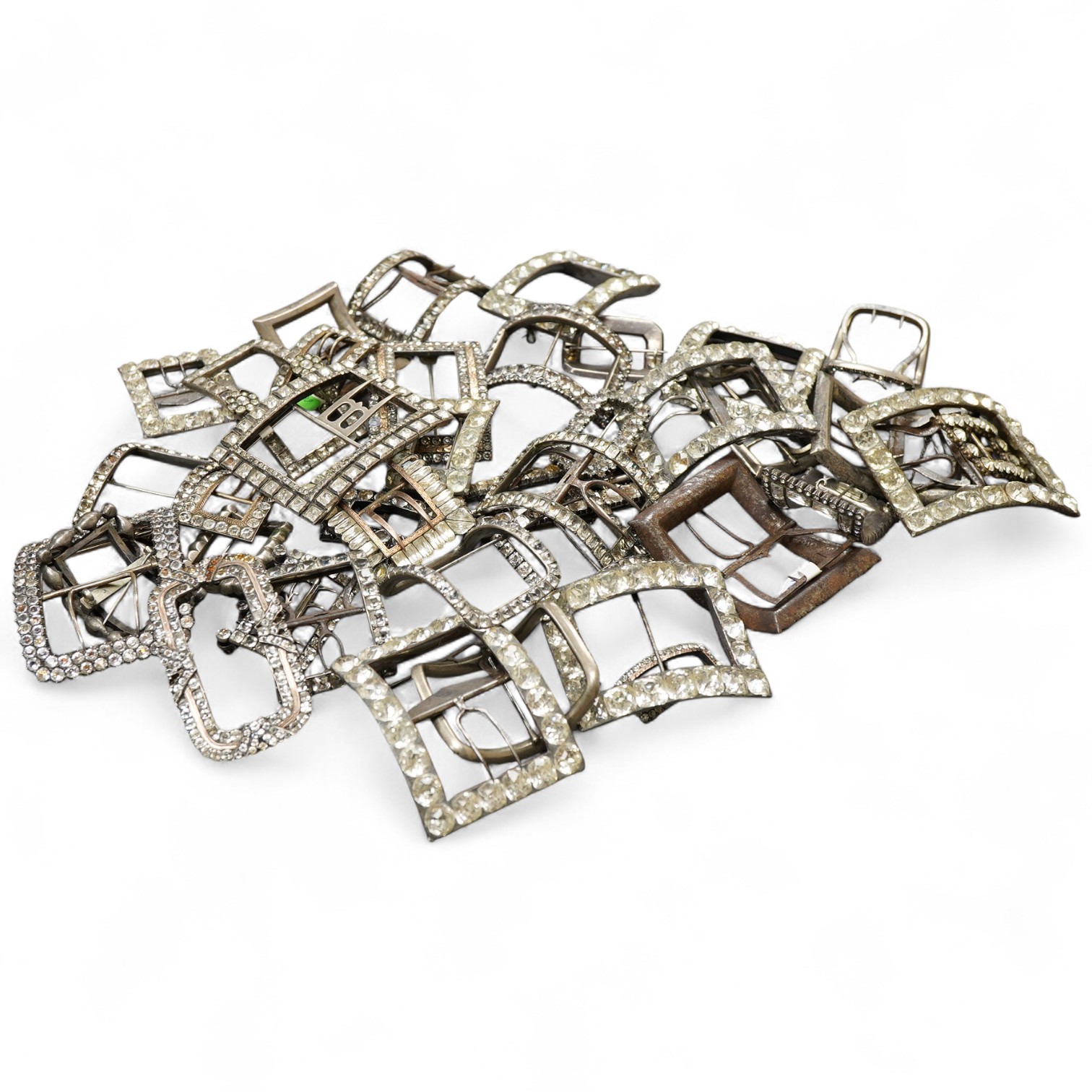 A large collection of shoe buckles, 18th-19th century, of rectangular outline, set with pastes, mostly mounted in steel, a minority in silver, some with later brooch fittings